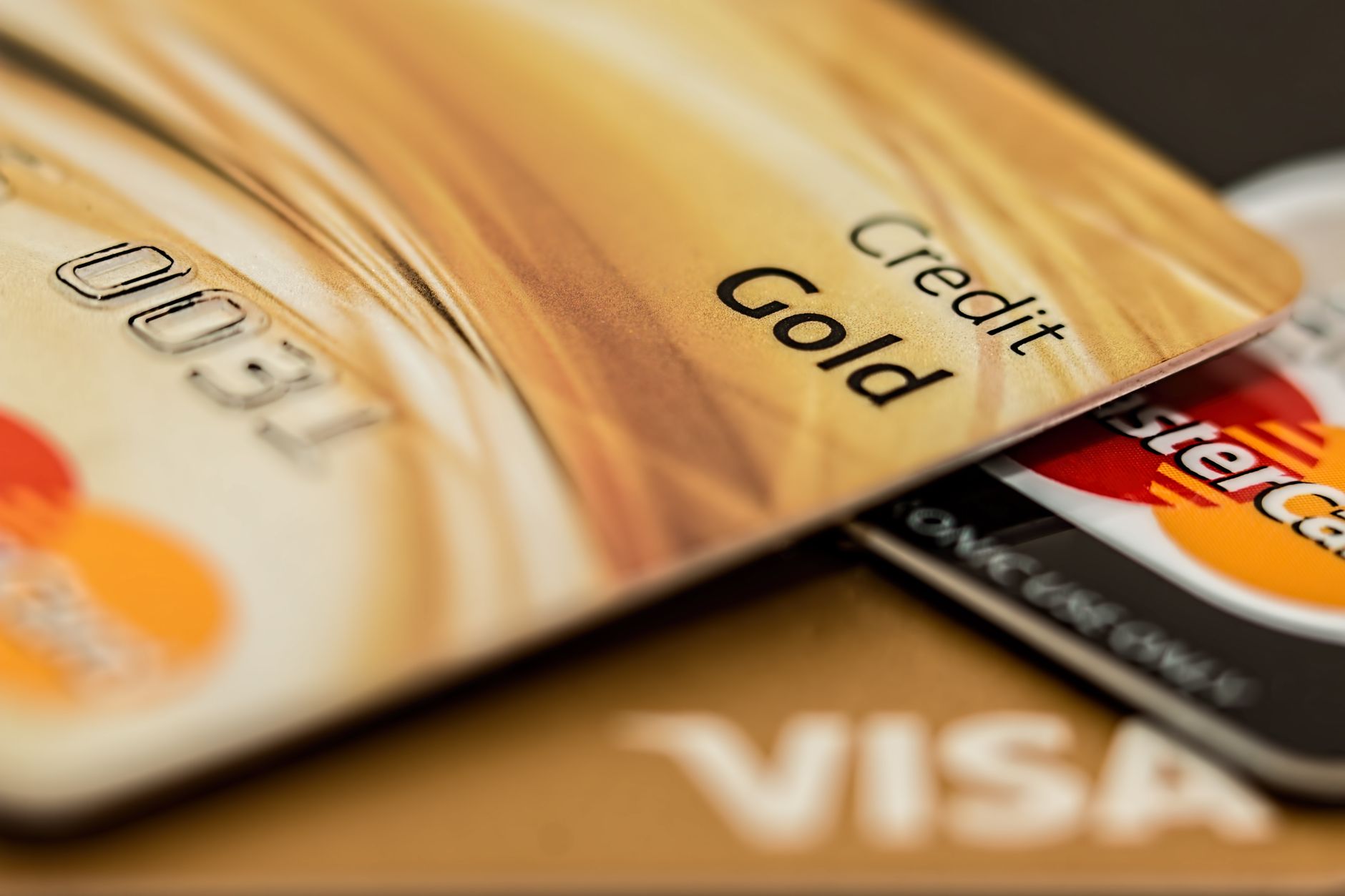 微商和社区团购怎么收款:Stack of various branded credit cards focusing o 微商和社区团购怎么收款:Stack of various branded credit cards focusing o