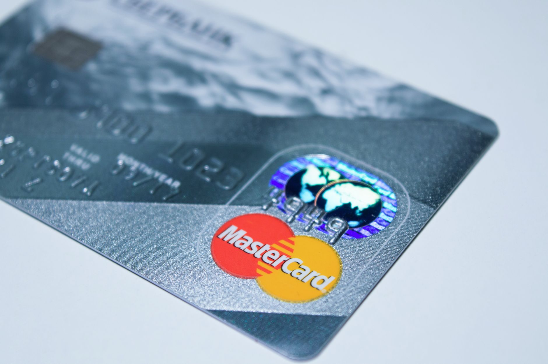 Detail shot of a MasterCard credit card, showing the chip an Detail shot of a MasterCard credit card, showing the chip an
